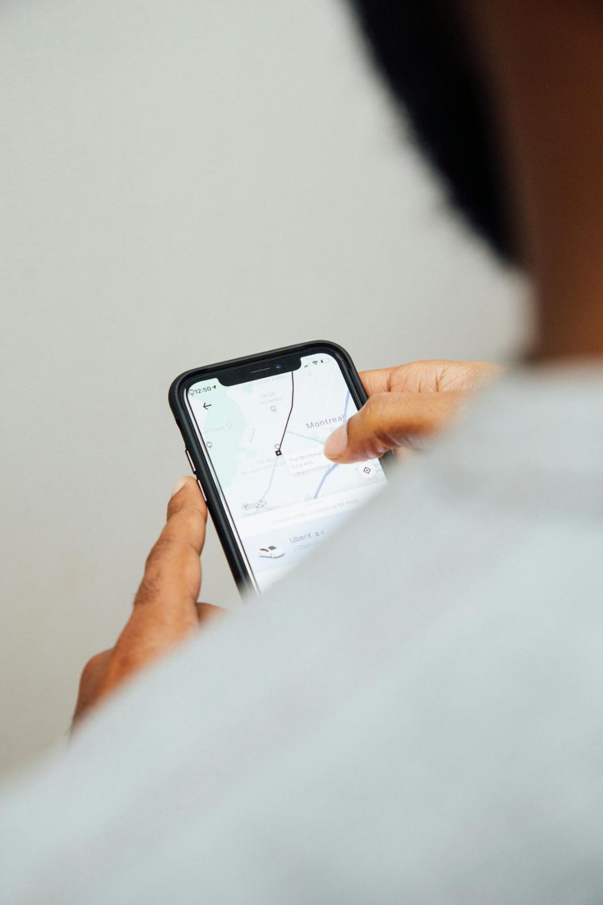Person holding a phone with a map app open